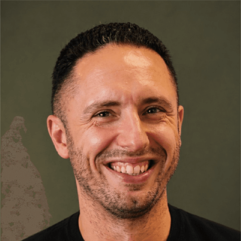 Professional headshot of Simon Sothcott, founder of Zebra North, smiling warmly.